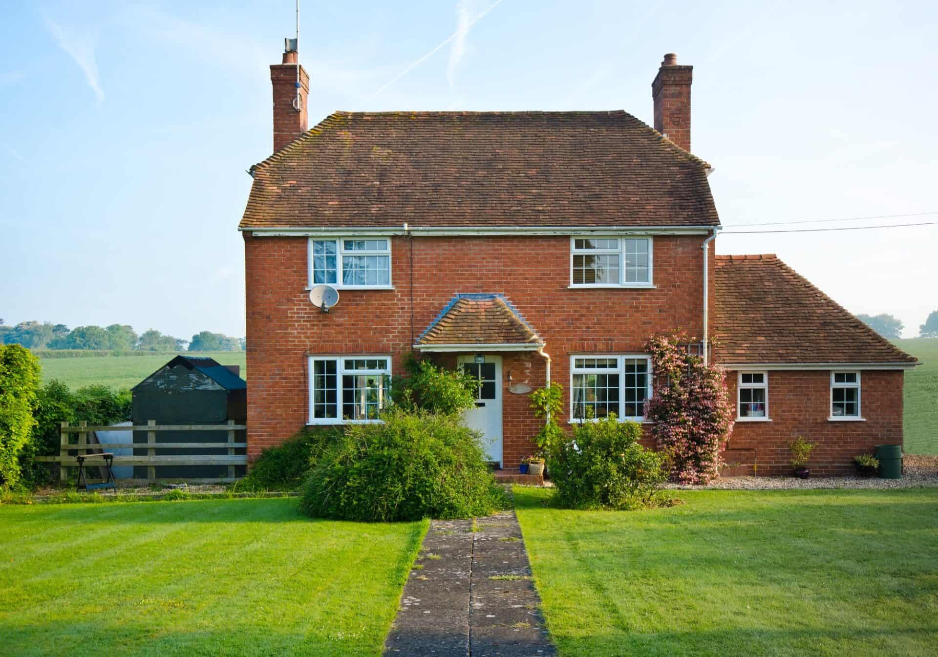 Brick detached house with a front garden